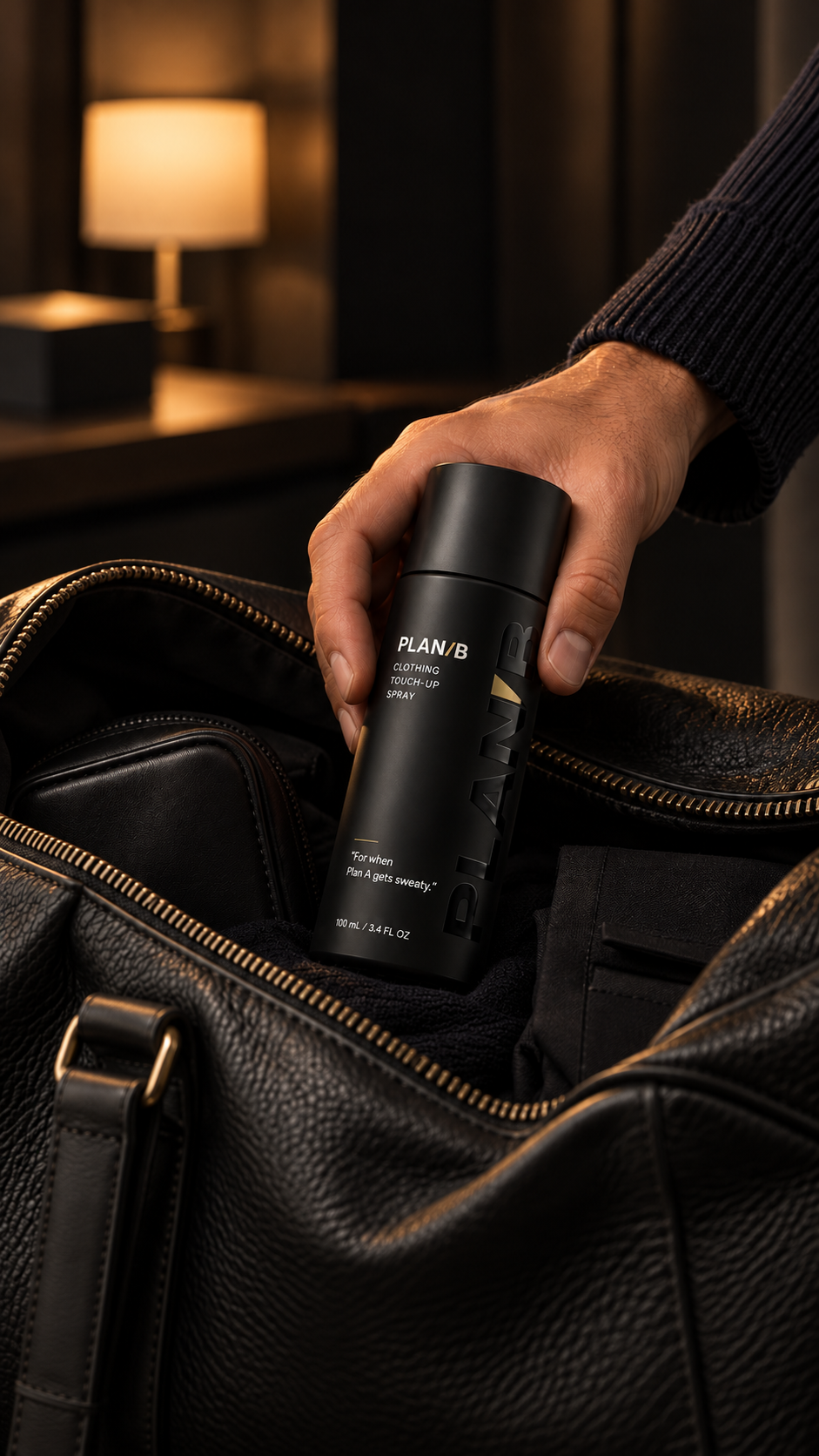 Hand lifting Plan B from a leather holdall